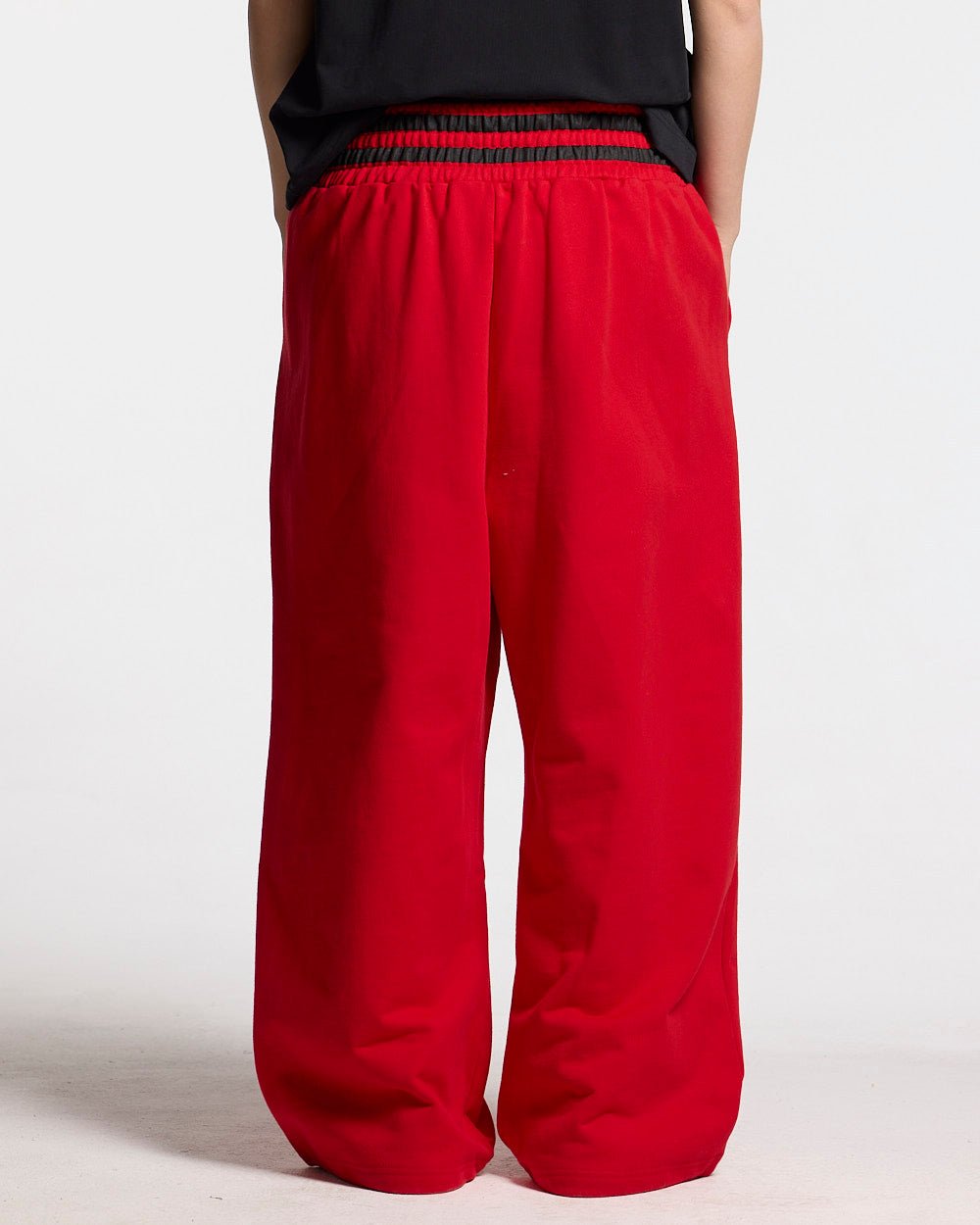 RAGE IN THE RING PANTS RED - red baggy sweatpants, back view on female model - Cold Culture #woman