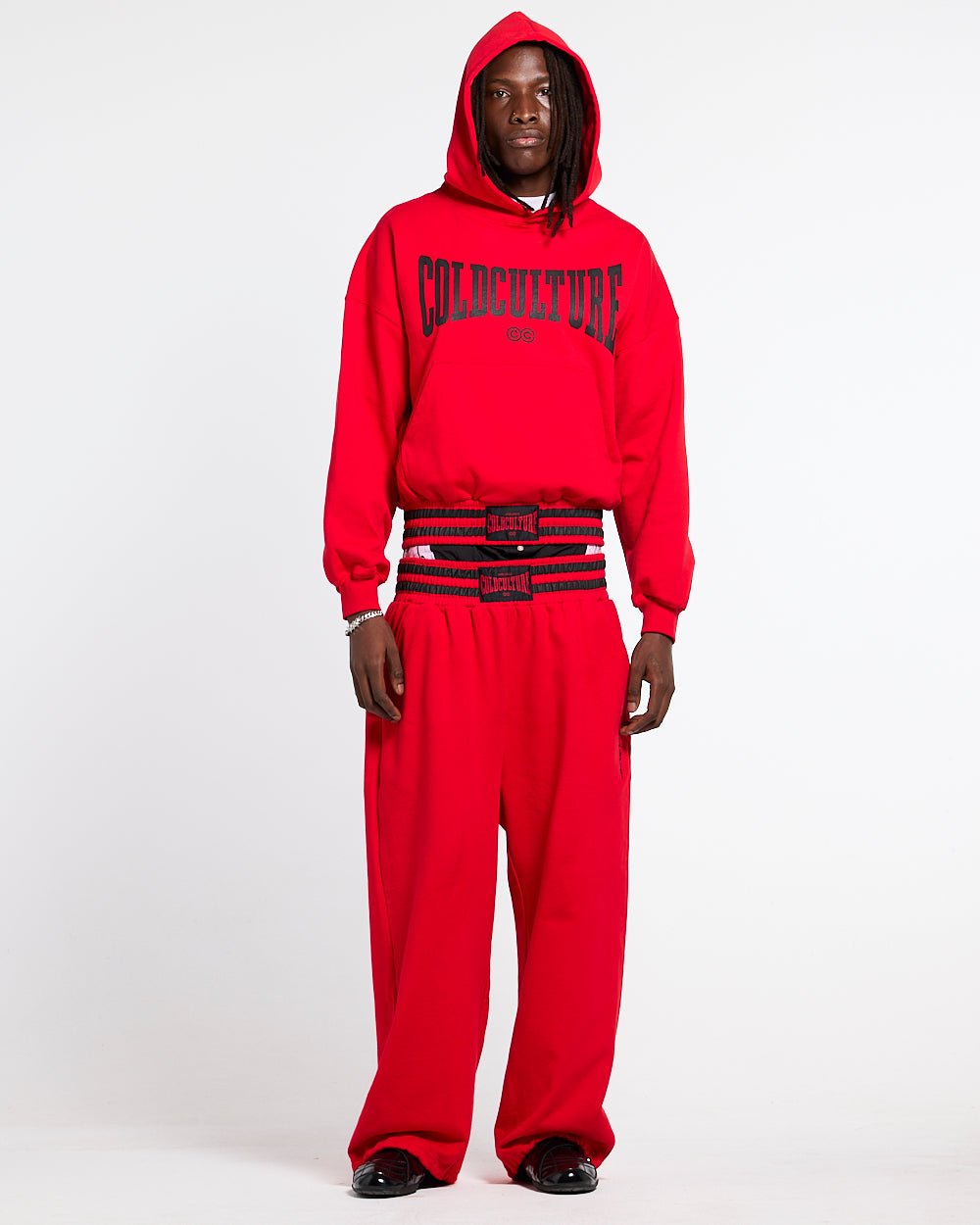 RAGE IN THE RING PANTS RED - red baggy sweatpants, front view on male model - Cold Culture #man