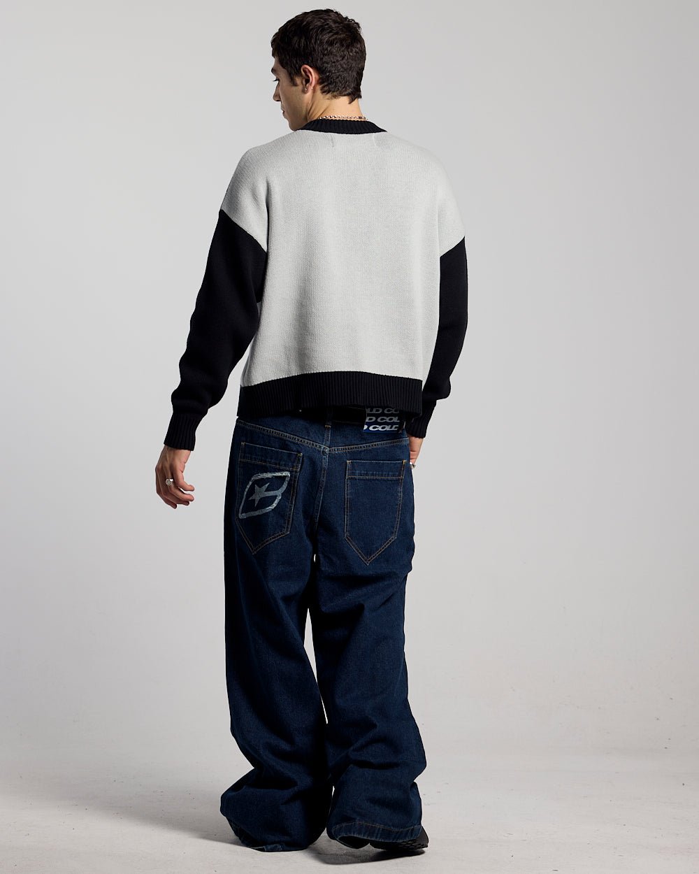 RAGE KNIT GREY - grey and black script knit sweater, back view on male model - Cold Culture #man