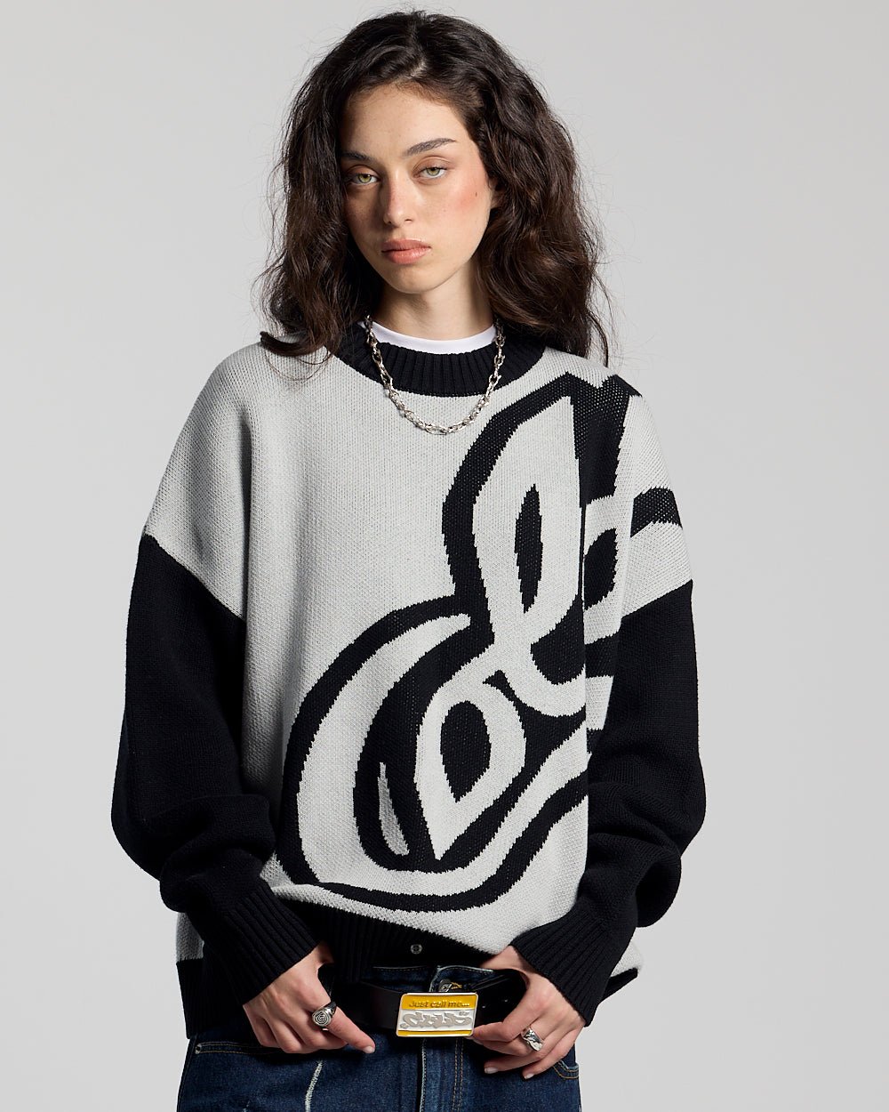 RAGE KNIT GREY - grey and black script knit sweater, front view on female model - Cold Culture #woman