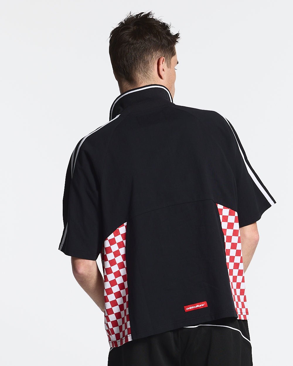 RED CHESS POLO TSHIRT BLACK - black checkered polo shirt, back view on male model - Cold Culture #man
