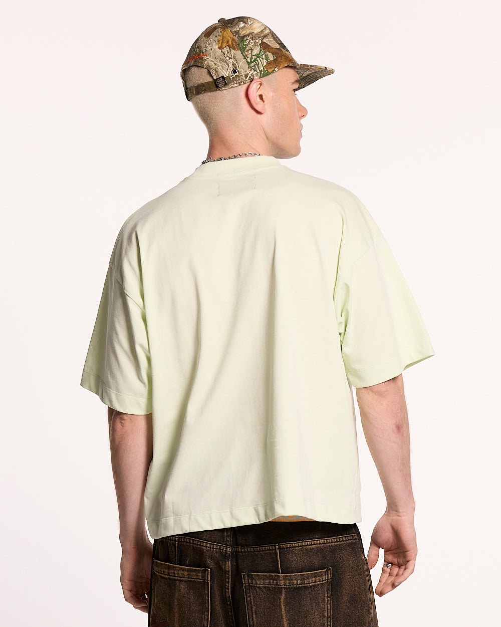 RELENTLESS TEE LIME - lime graphic print tee, back view on male model - Cold Culture #man