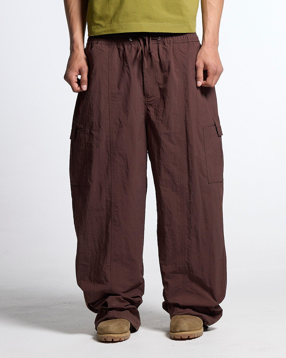 RESERVED CARGO PANTS BROWN - brown nylon cargo pants, front view on male model - Cold Culture