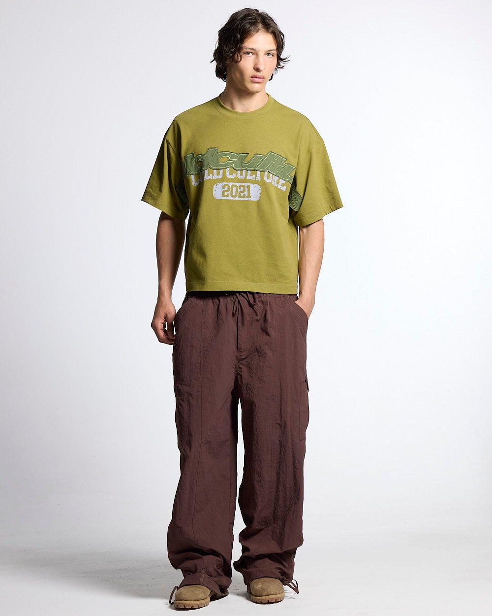 RESERVED CARGO PANTS BROWN - brown nylon cargo pants, front view on male model - Cold Culture #man