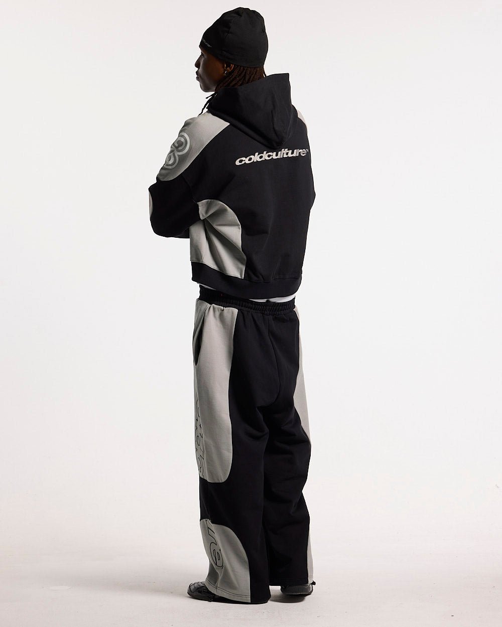 RIDER SWEATPANTS BLACK & GREY - black and grey paneled sweatpants, back view on male model - Cold Culture #man