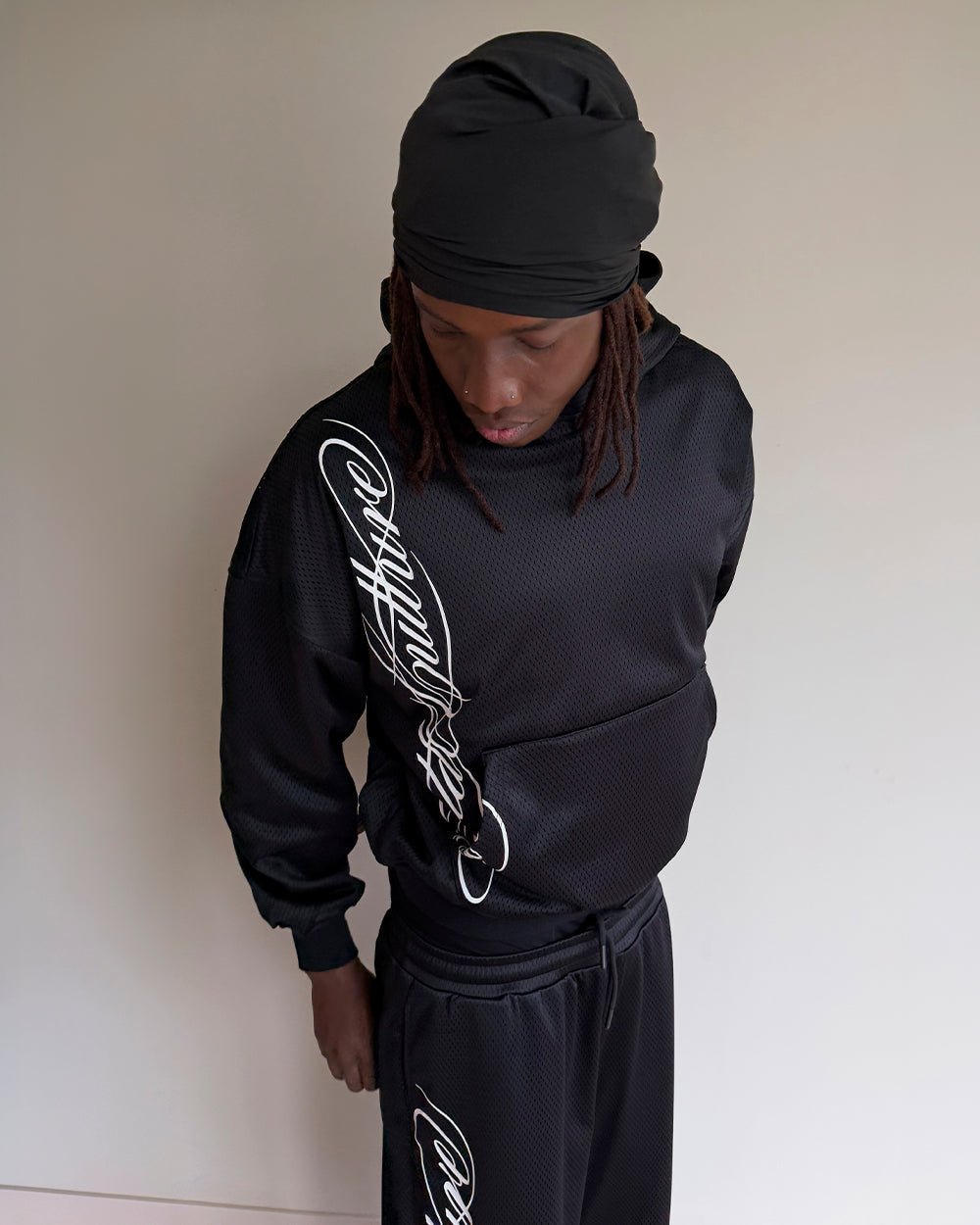 RIOT MESH HOODIE BLACK - black mesh hoodie, front view on male model - Cold Culture