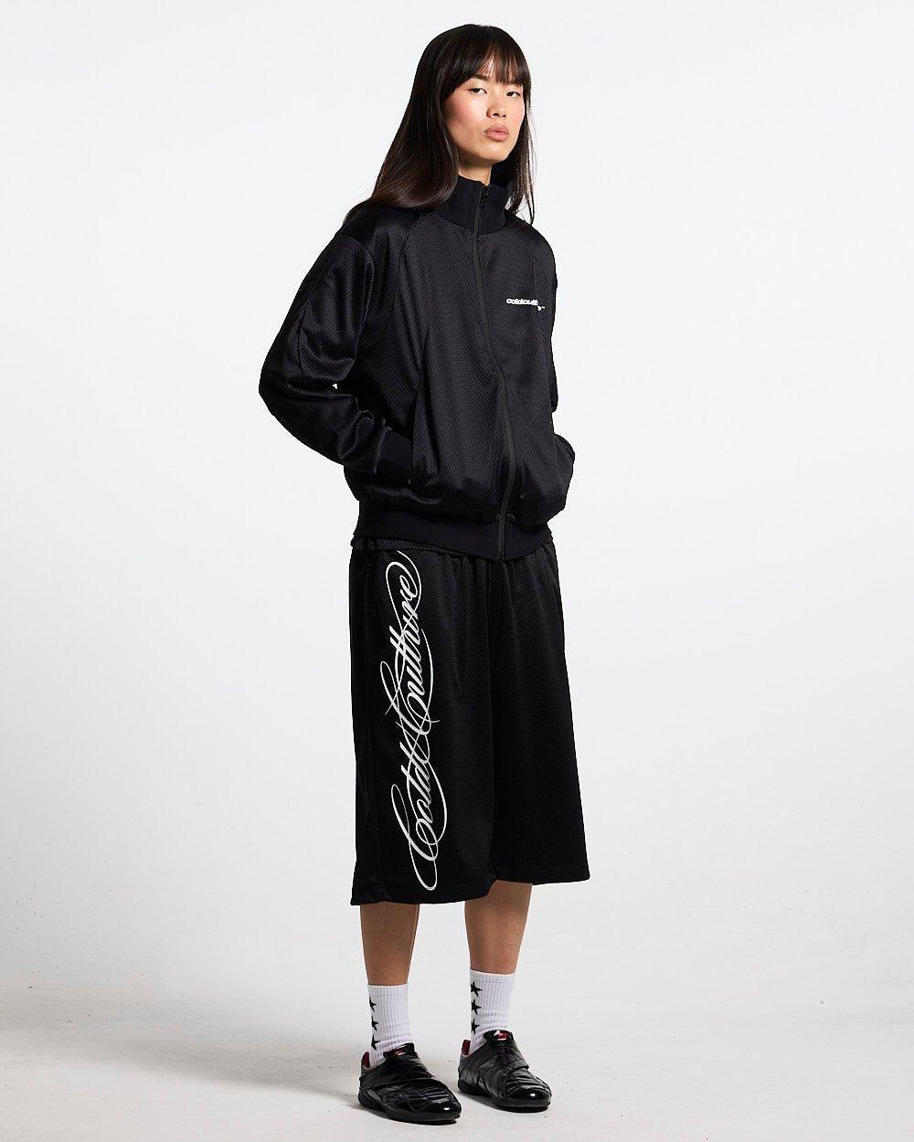 RIOT MESH JACKET BLACK - black mesh track jacket, front view on female model - Cold Culture #woman