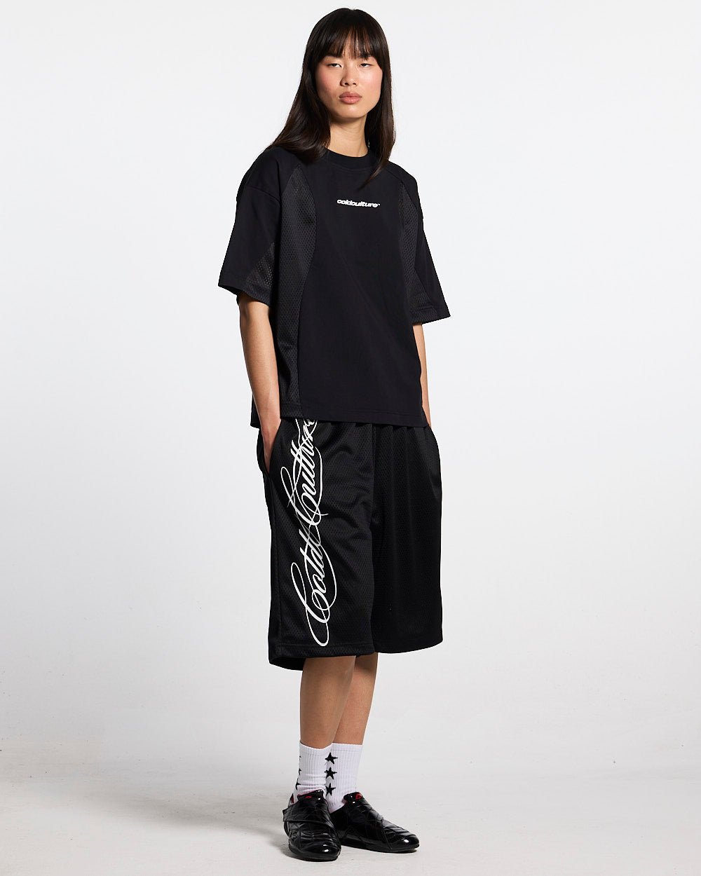 RIOT MESH SHORT BLACK - black mesh shorts, front view on female model - Cold Culture #woman
