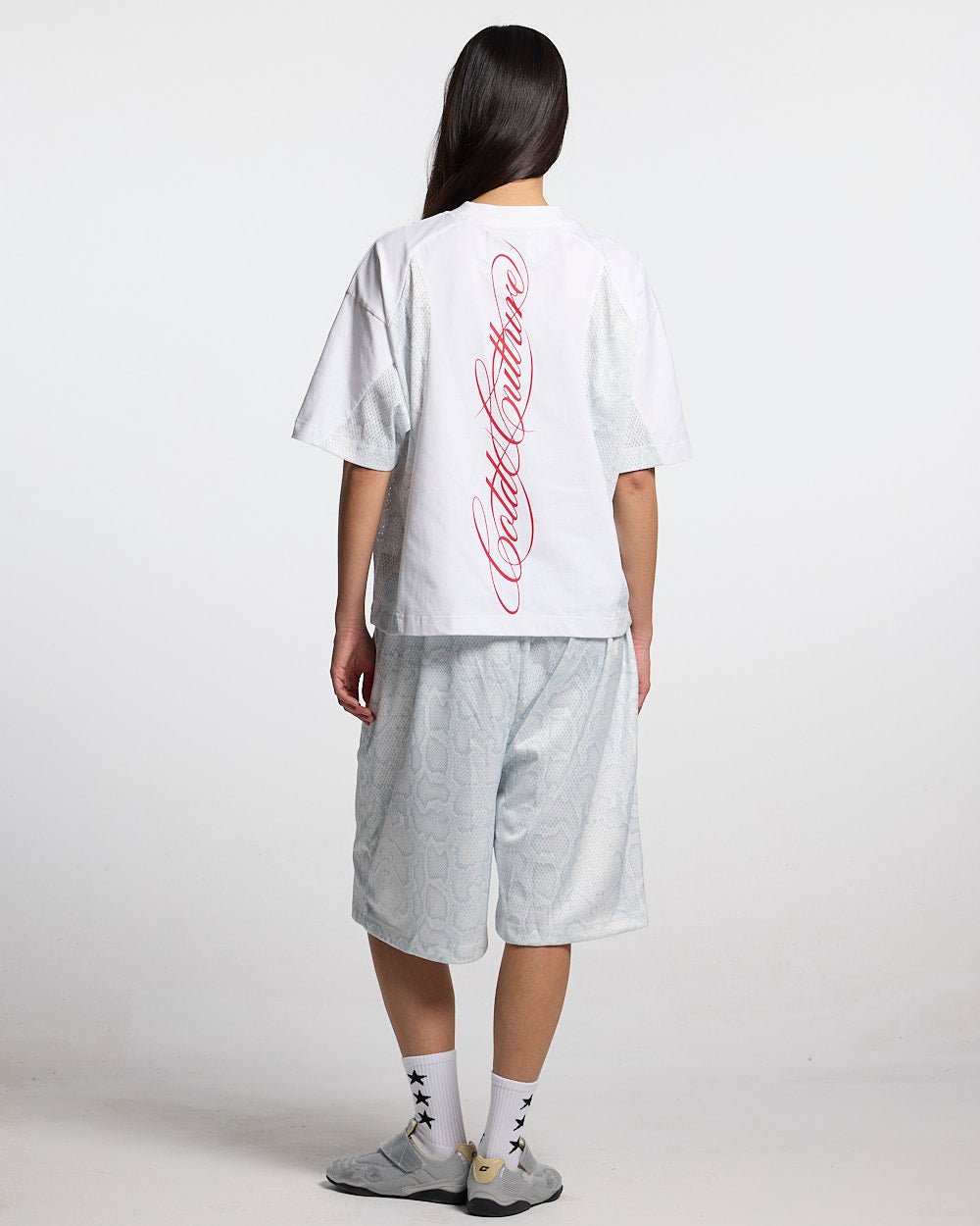 RIOT MESH SHORT WHITE - white snake print mesh shorts, back view on female model - Cold Culture #woman