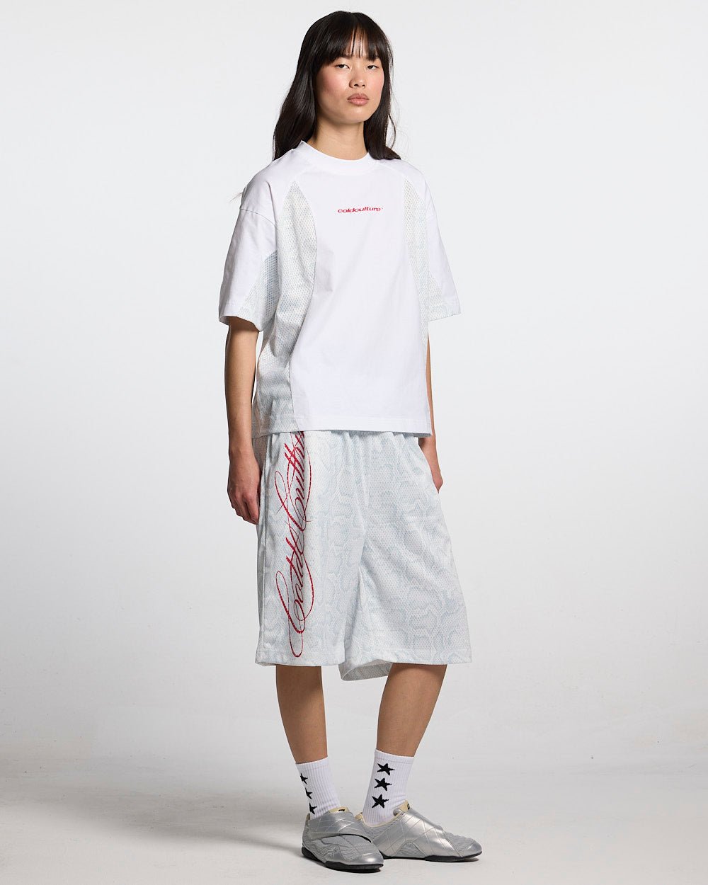 RIOT MESH SHORT WHITE - white snake print mesh shorts, front view on female model - Cold Culture #woman