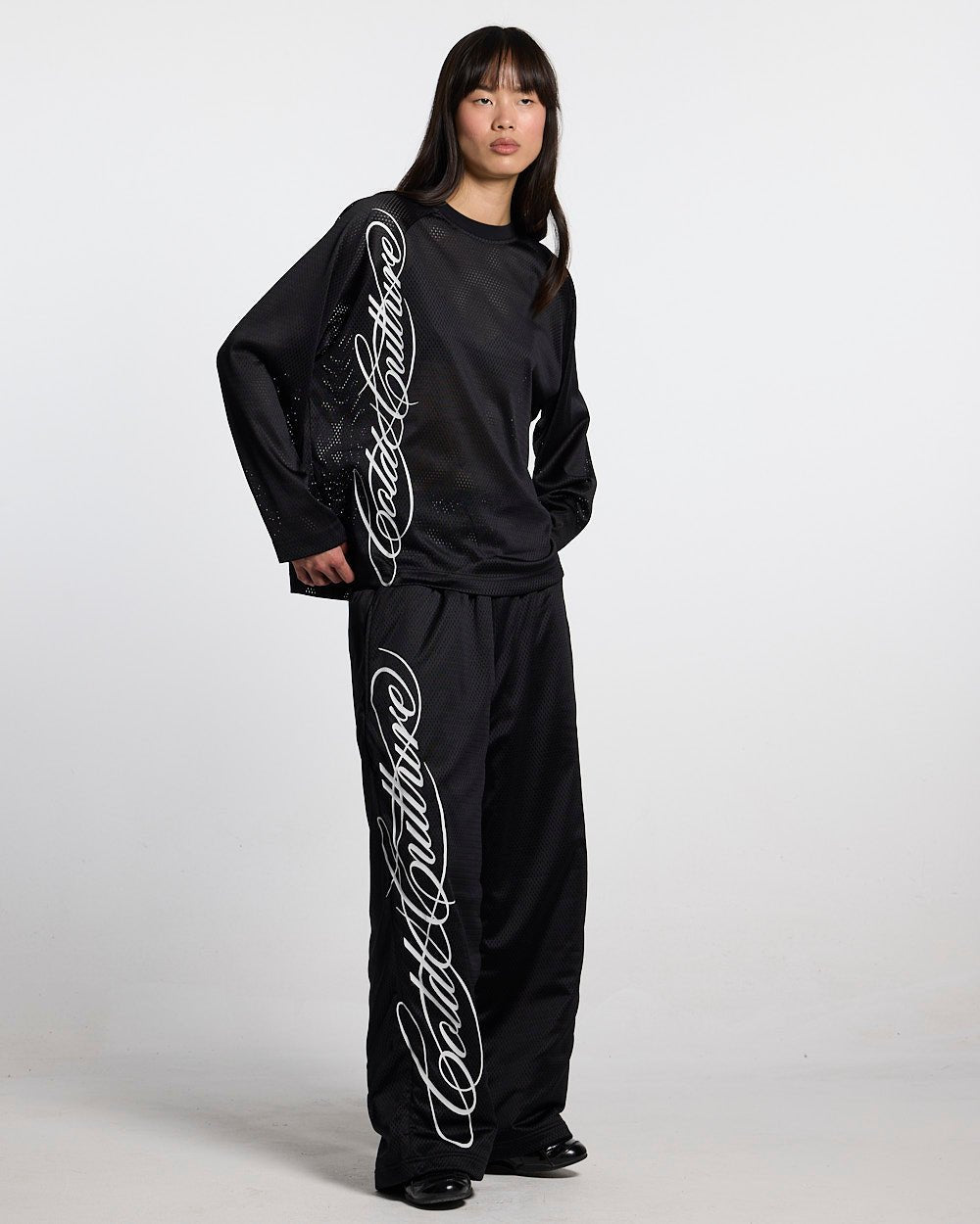 RIOT MESH SWEATPANTS BLACK - black mesh sweatpants, front view on female model - Cold Culture #woman