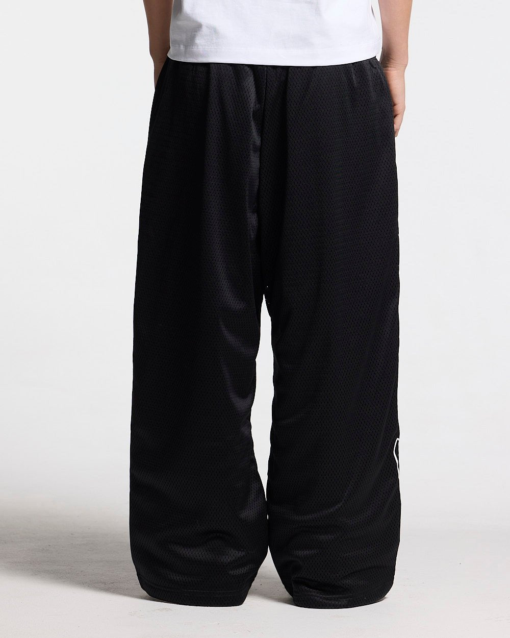 RIOT MESH SWEATPANTS BLACK - black mesh sweatpants, back view on female model - Cold Culture #woman