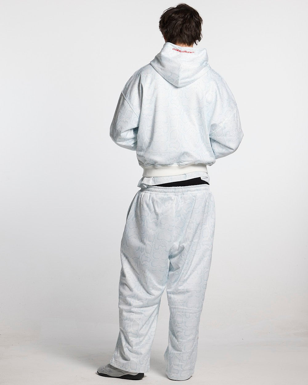 RIOT MESH SWEATPANTS WHITE - white snakeskin print sweatpants, back view on male model - Cold Culture