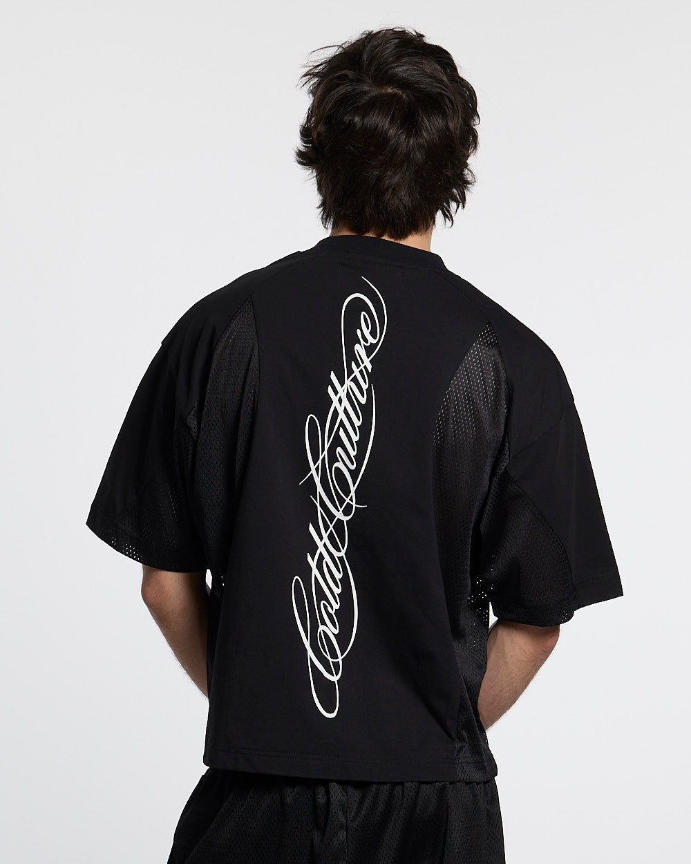 RIOT MESH TEE BLACK - black mesh panel tee, back view on male model - Cold Culture #man