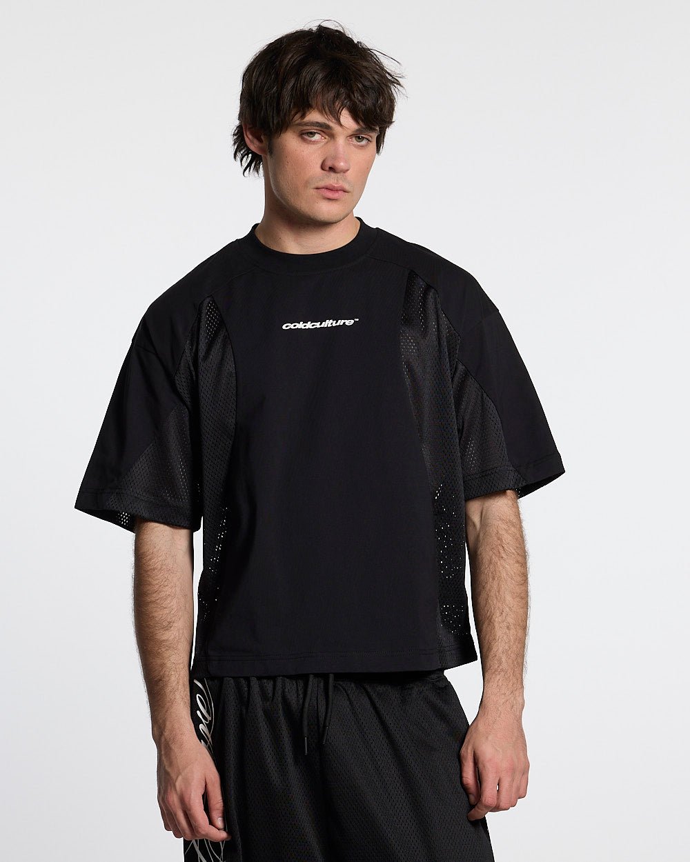RIOT MESH TEE BLACK - black mesh panel tee, front view on male model - Cold Culture #man