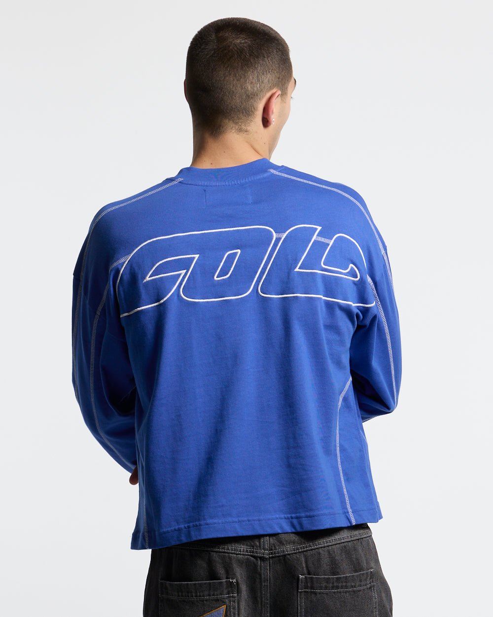 ROLLER LONGSLEEVE TEE VIBRANT BLUE - blue contrast stitch longsleeve tee, back view on male model - Cold Culture #man