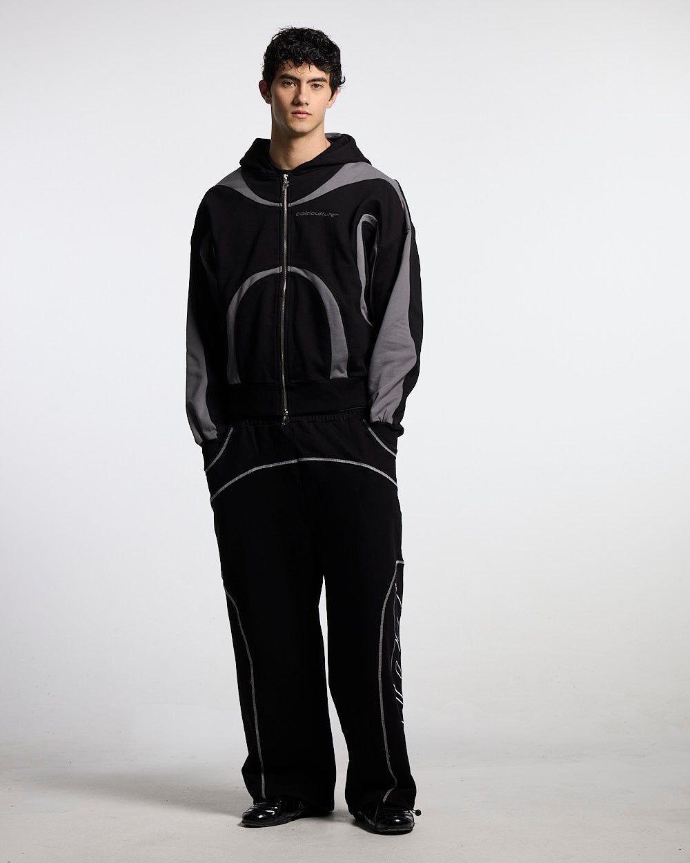 ROLLER SWEATPANTS BLACK - black contrast stitch sweatpants, front view on male model - Cold Culture #man