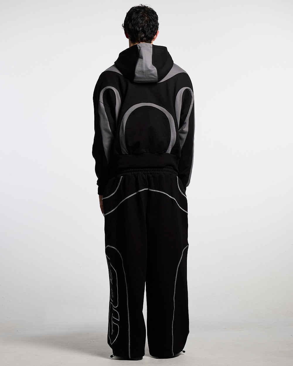 ROLLER SWEATPANTS BLACK - black contrast stitch sweatpants, back view on male model - Cold Culture
