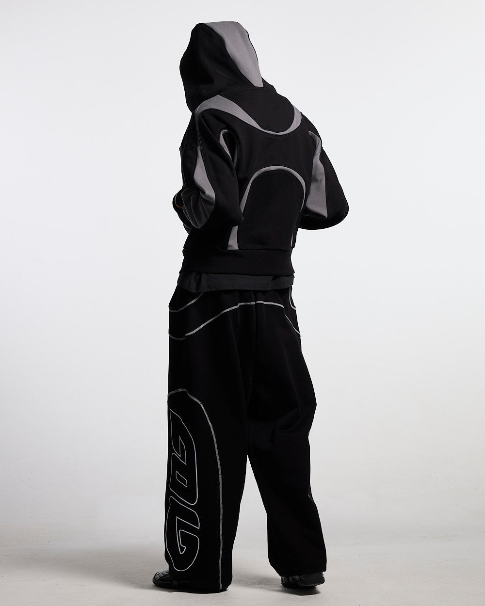 ROLLER SWEATPANTS BLACK - black contrast stitch sweatpants, back view on female model - Cold Culture #woman