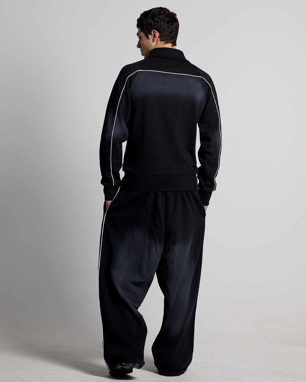 SAVAGE WASHED PANTS BLACK & WHITE - black and white washed sweatpants, back view on male model - Cold Culture #man