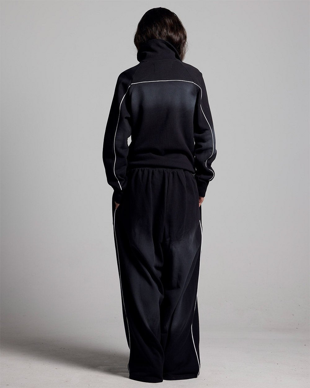 SAVAGE WASHED PANTS BLACK & WHITE - black and white washed sweatpants, back view on female model - Cold Culture #woman