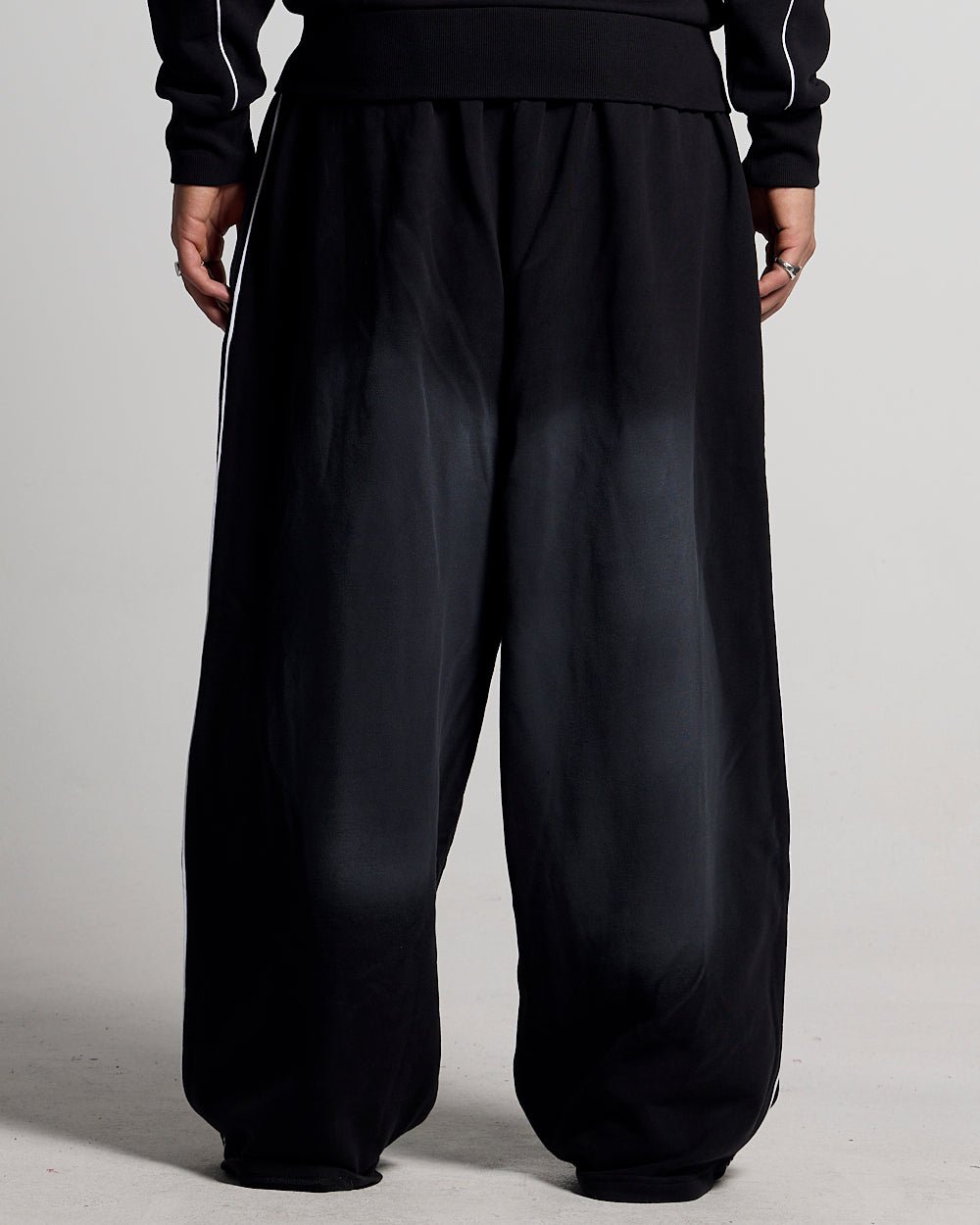 SAVAGE WASHED PANTS BLACK & WHITE - black and white washed sweatpants, back view on male model - Cold Culture