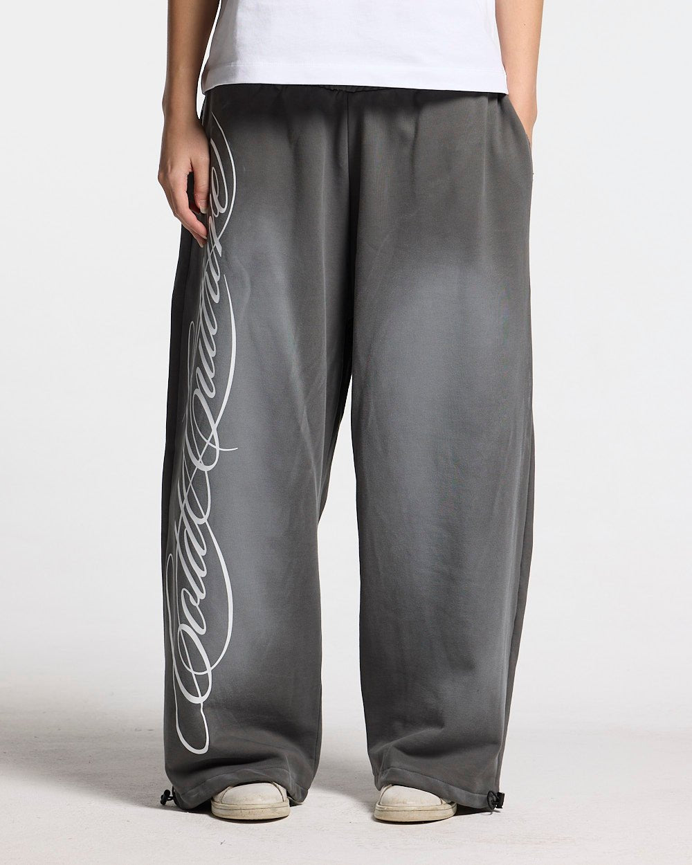 SCRIPT SWEATPANTS ANTRACITE GREY - dark grey script print sweatpants, front view on female model - Cold Culture