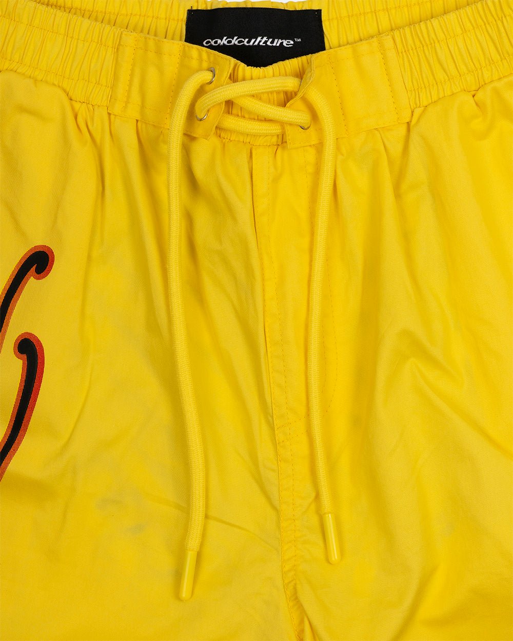 SCRIPT SWIMSHORTS YELLOW - yellow script print swim shorts, detail close-up - Cold Culture