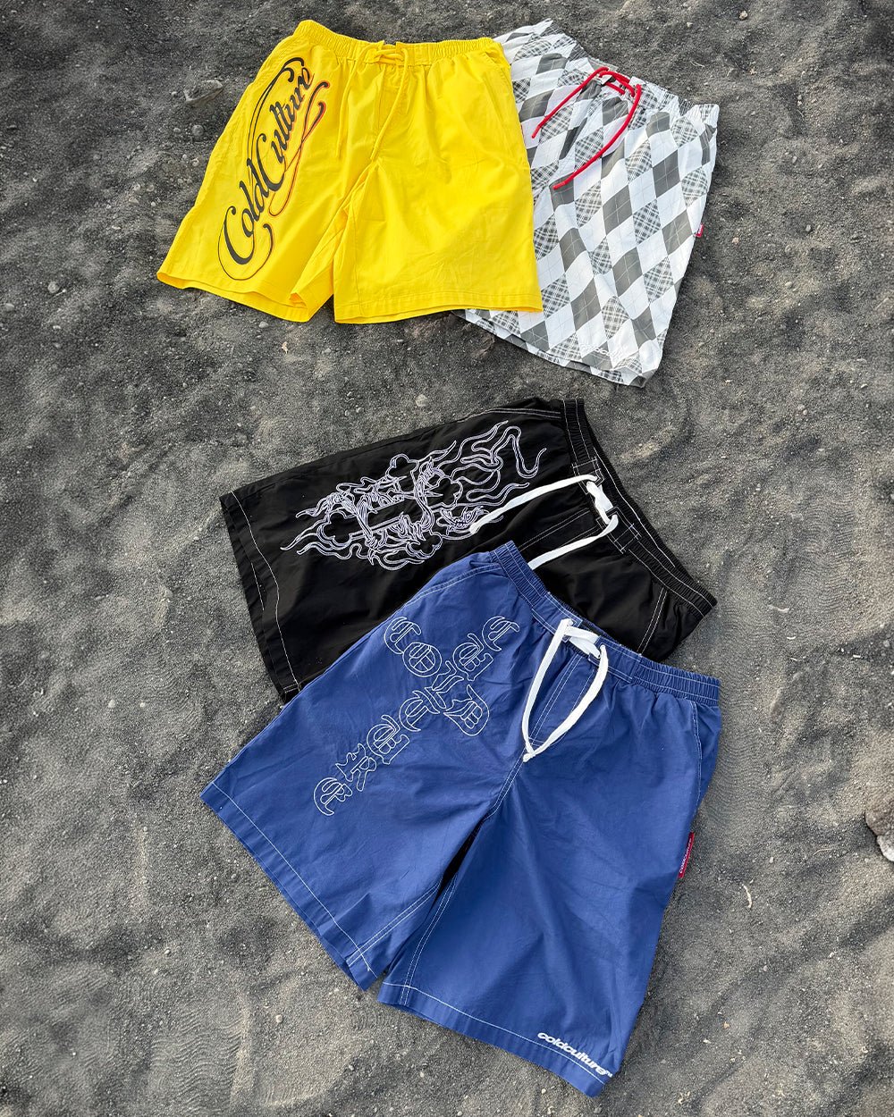 SCRIPT SWIMSHORTS YELLOW - yellow script print swim shorts, flat lay with matching pieces - Cold Culture