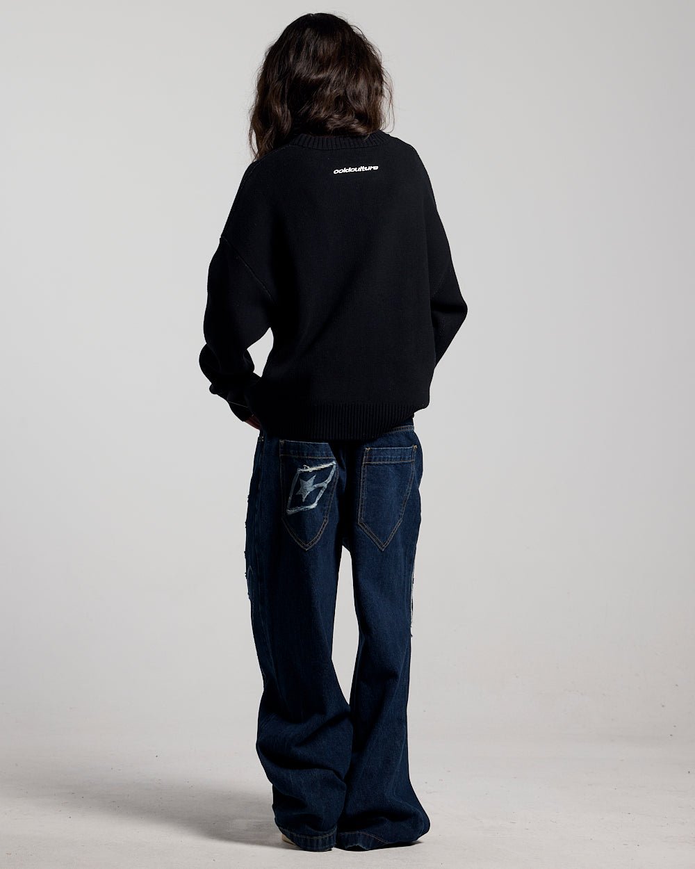 SCRIPT V3 PANTS RAW DENIM - dark blue baggy denim pants, back view on female model - Cold Culture #woman
