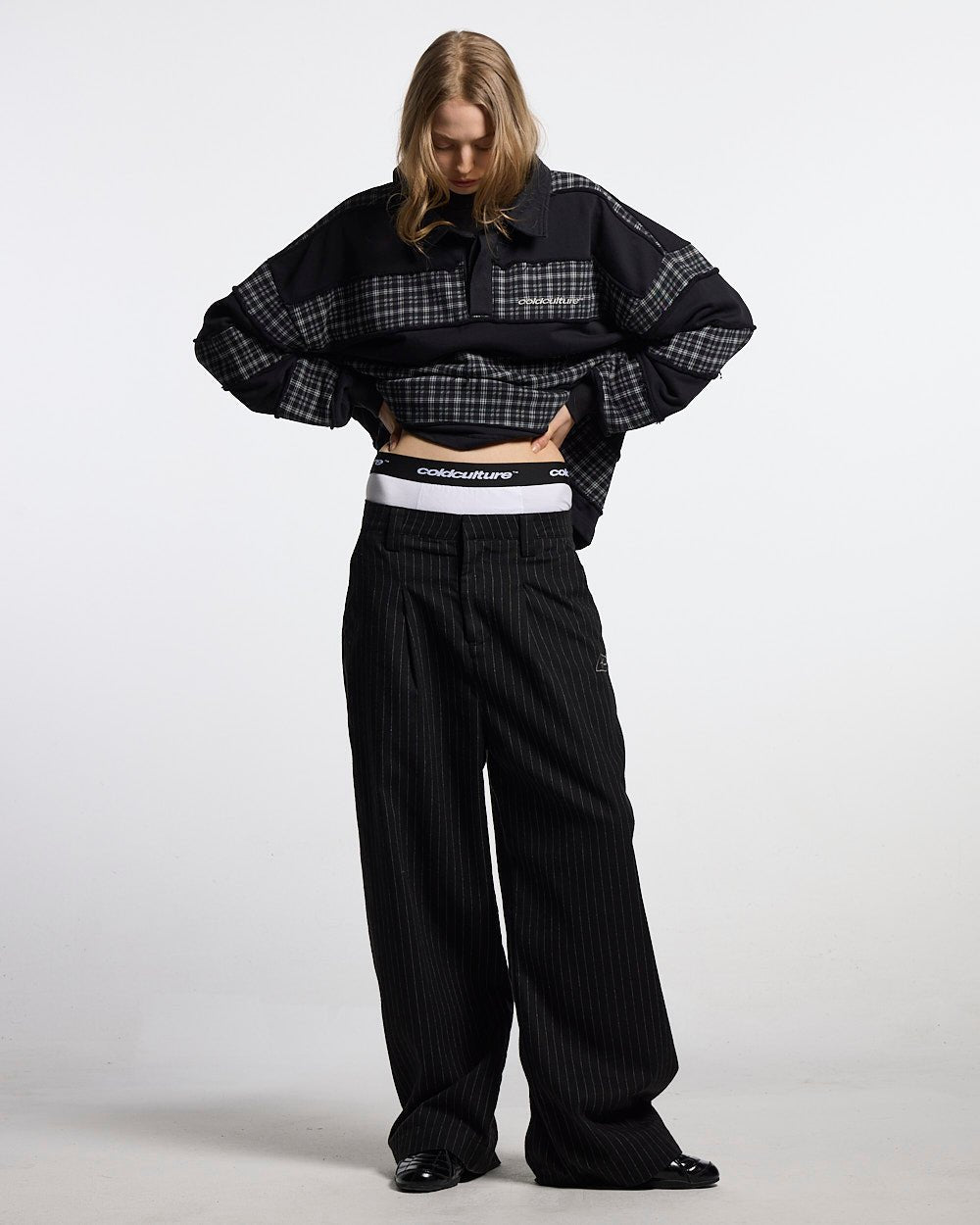 SEAM EFFECT LINE PANTS BLACK - black pinstripe pants, front view on female model - Cold Culture #woman