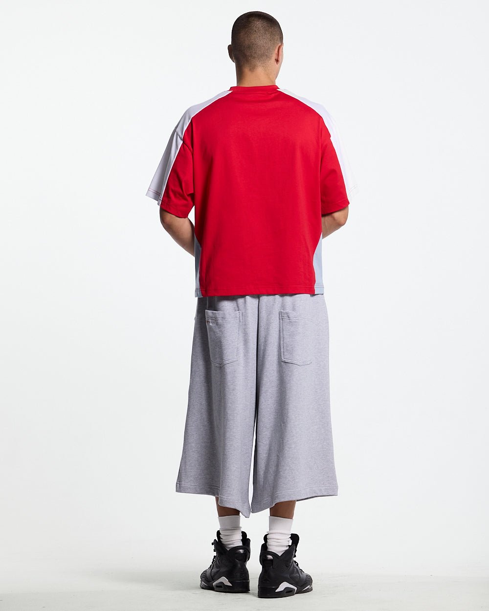 SNAPPED V2 JORTS HEATHER GREY - heather grey oversized sweat shorts, back view on male model - Cold Culture #man
