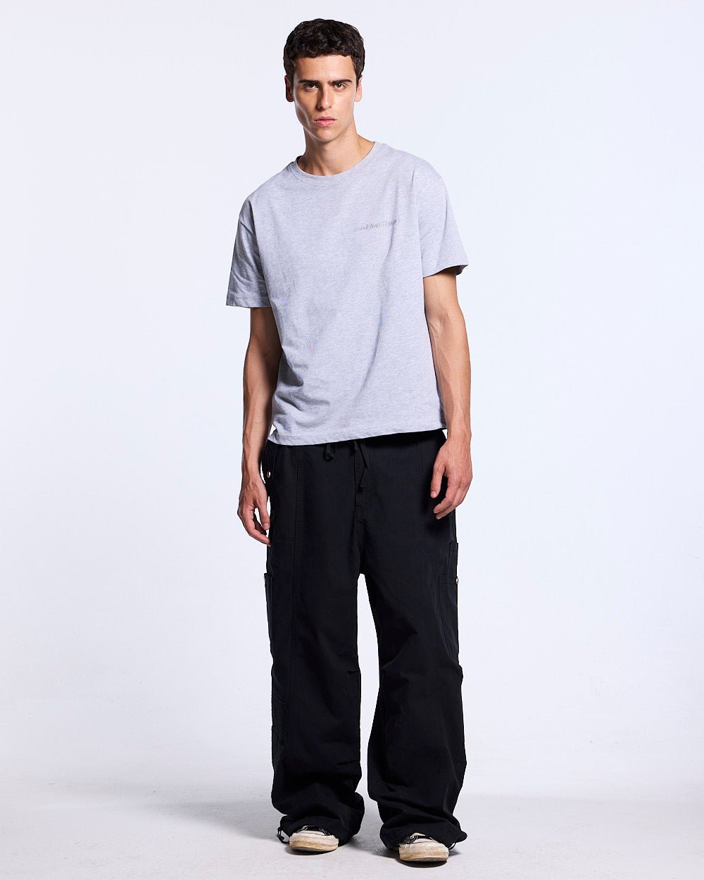 SOLID CARGO PANTS BLACK - black cargo pants, front view on male model - Cold Culture #man