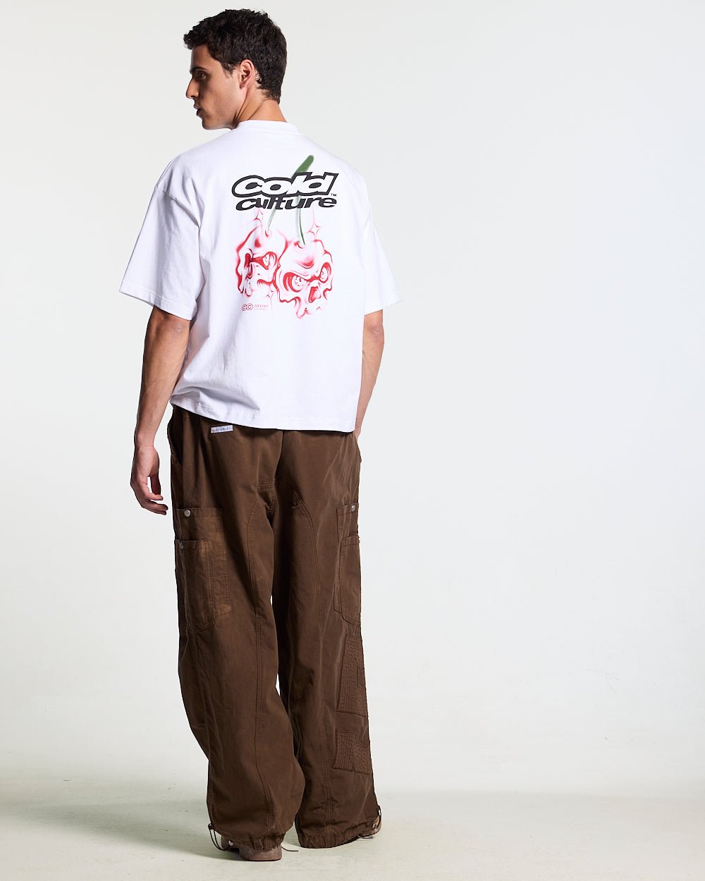 SOLID CARGO PANTS BROWN - brown cargo pants, back view on male model - Cold Culture #man