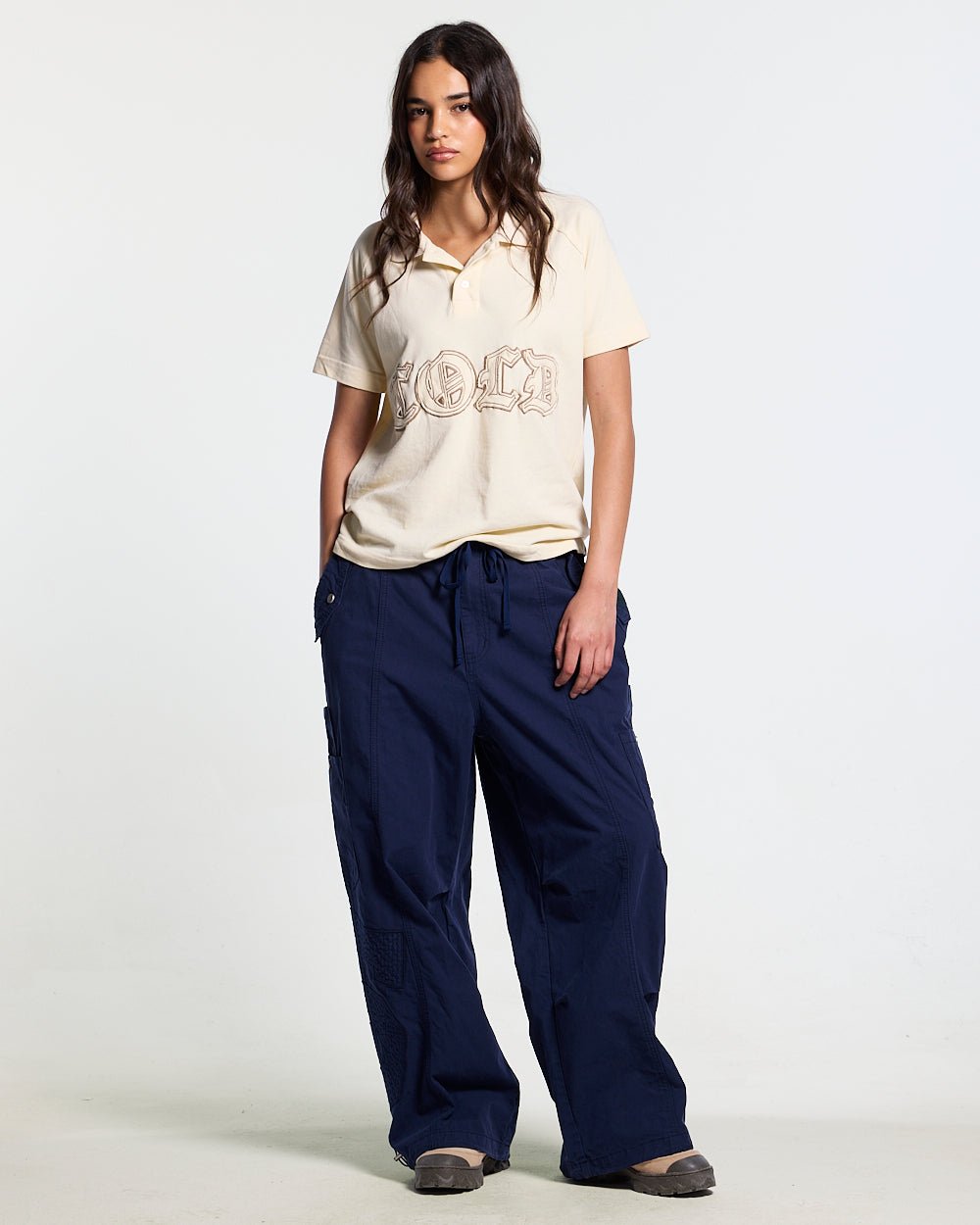 SOLID CARGO PANTS NAVY - navy cargo pants, front view on female model - Cold Culture #woman