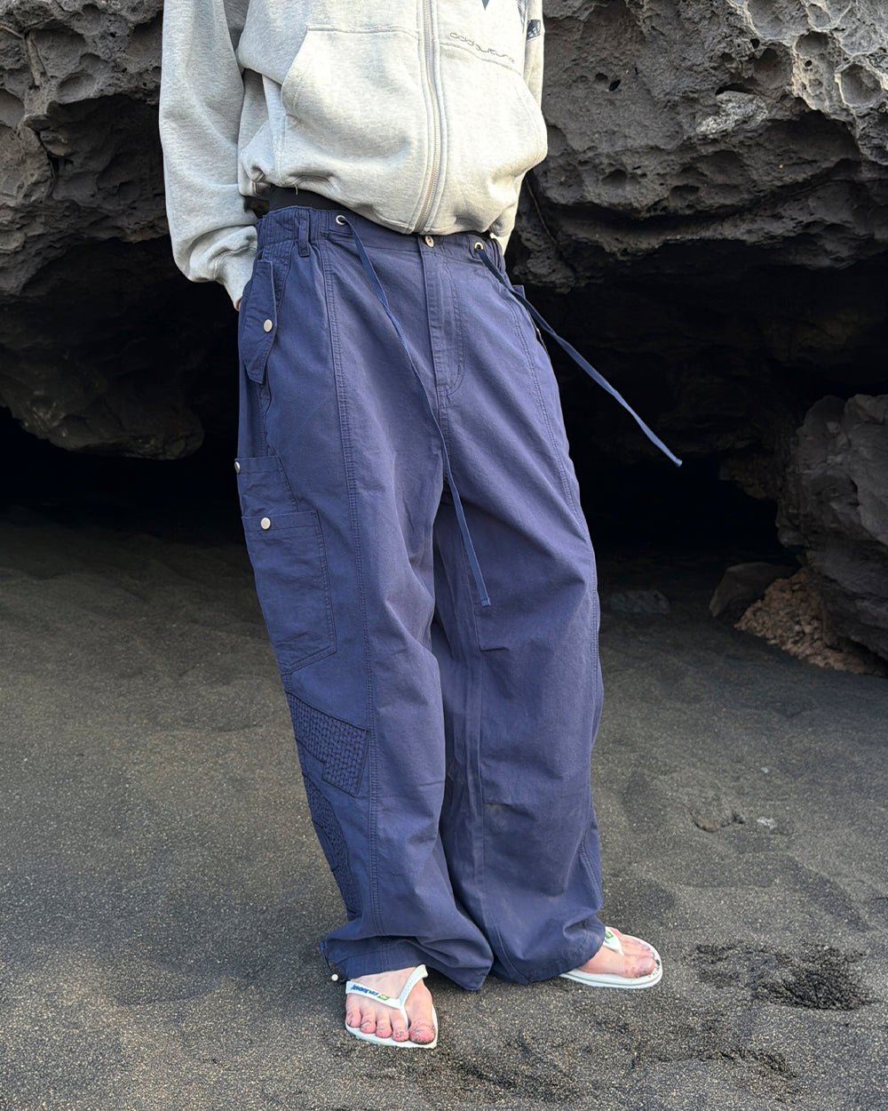 SOLID CARGO PANTS NAVY - navy cargo pants, street style shot - Cold Culture