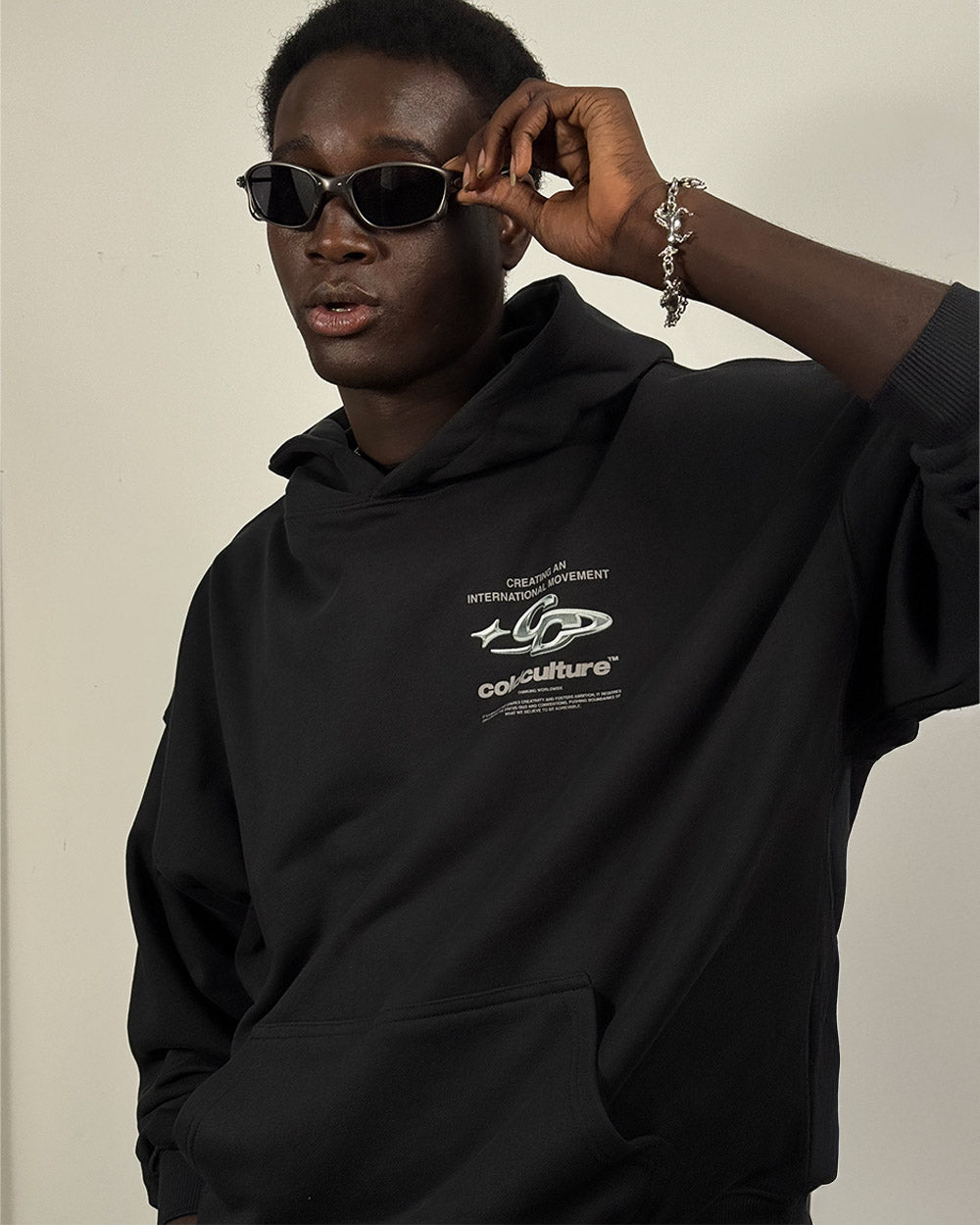 SPARKLY HOODIE BLACK - black graphic print hoodie, on model close-up - Cold Culture