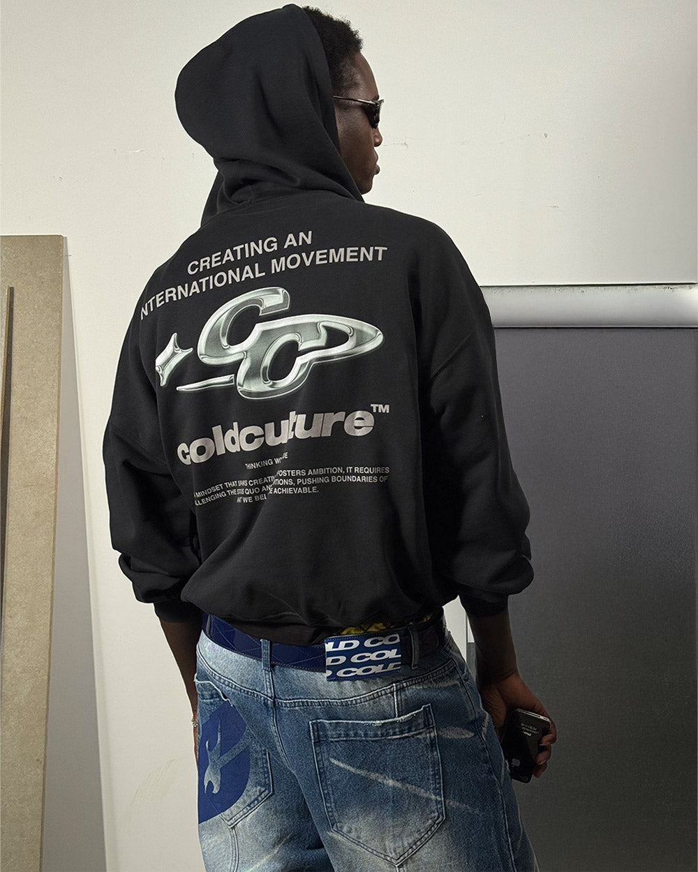 SPARKLY HOODIE BLACK - black graphic print hoodie, back view on male model - Cold Culture