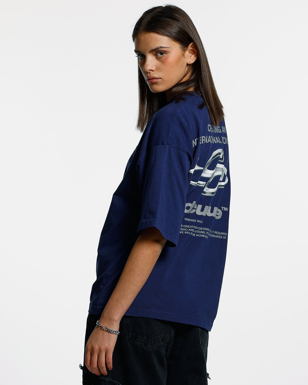 SPARKLY TEE COSMIC BLUE - navy blue graphic print tee, back view on female model - Cold Culture #woman