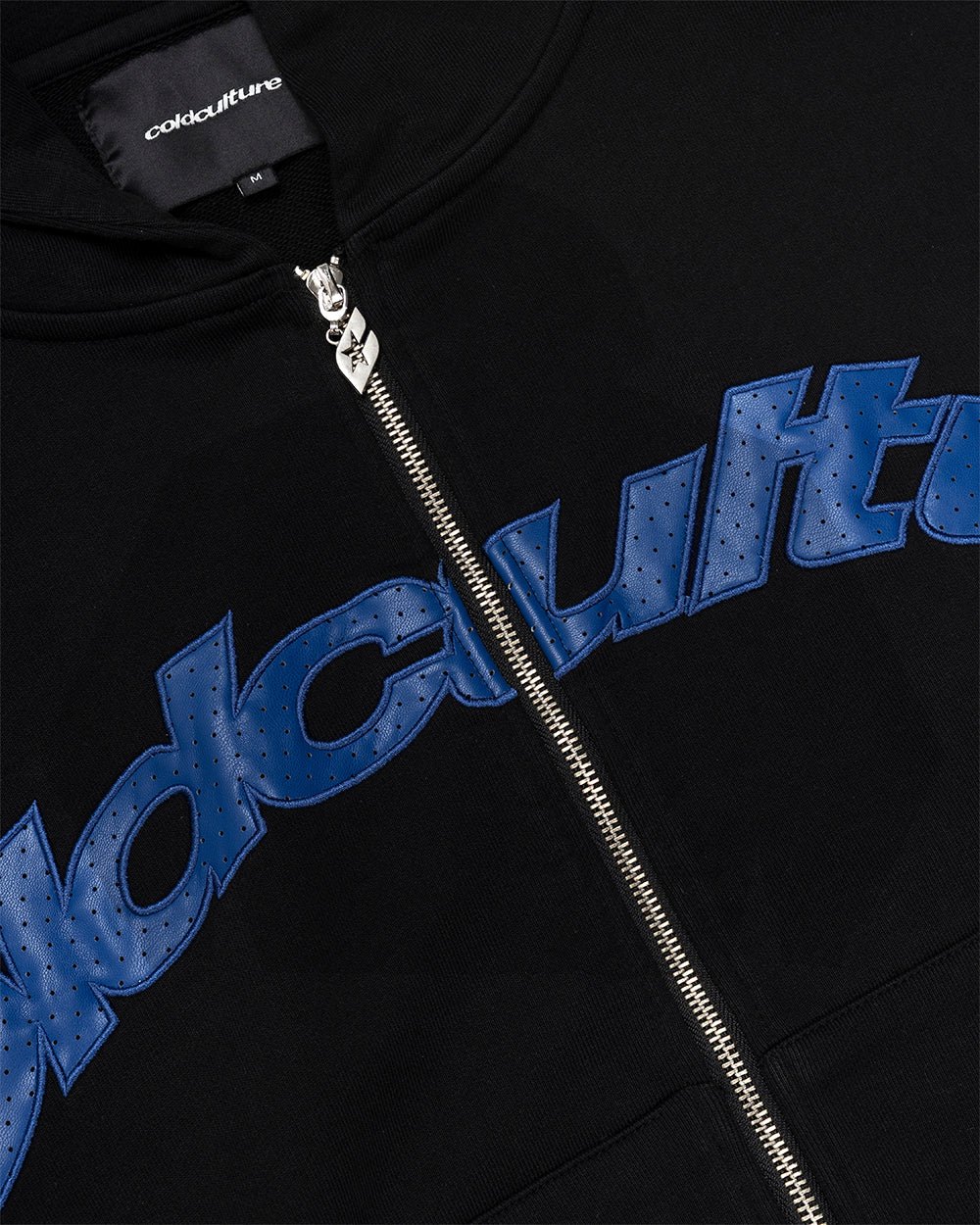 STAR CURVED ZIP HOODIE BLACK - black zip-up hoodie, detail close-up - Cold Culture