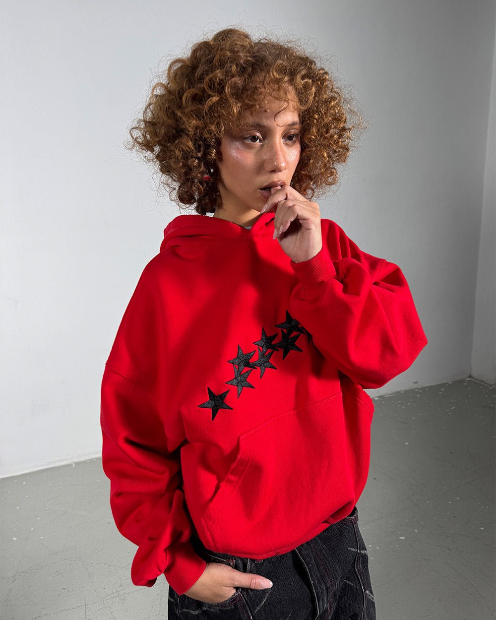 STARS HOODIE RED & BLACK - red star print hoodie, front view on female model - Cold Culture #woman