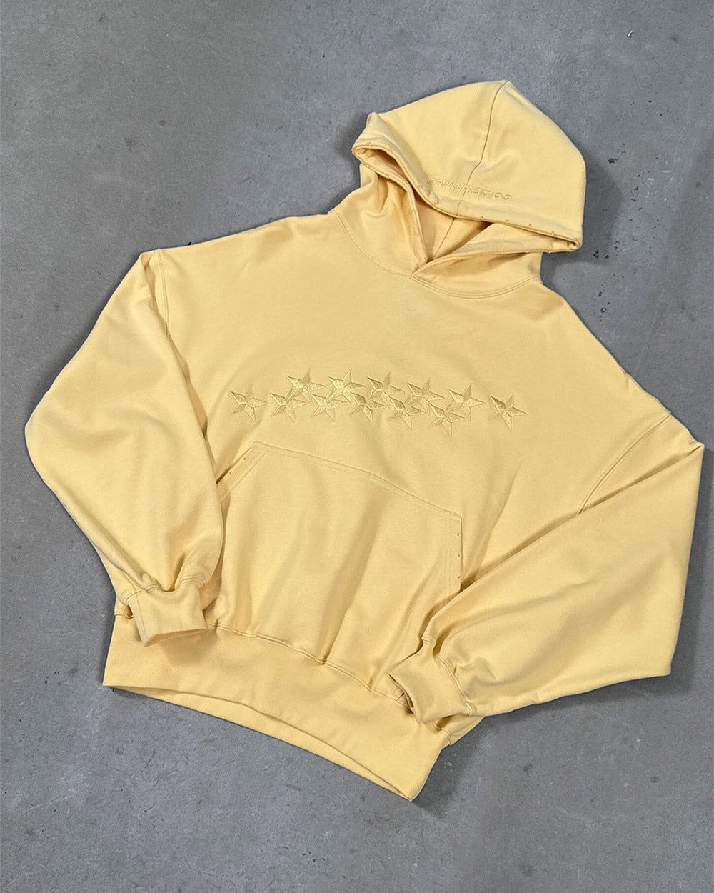 STARS HOODIE YELLOW - light yellow embroidered hoodie, flat lay - Cold Culture