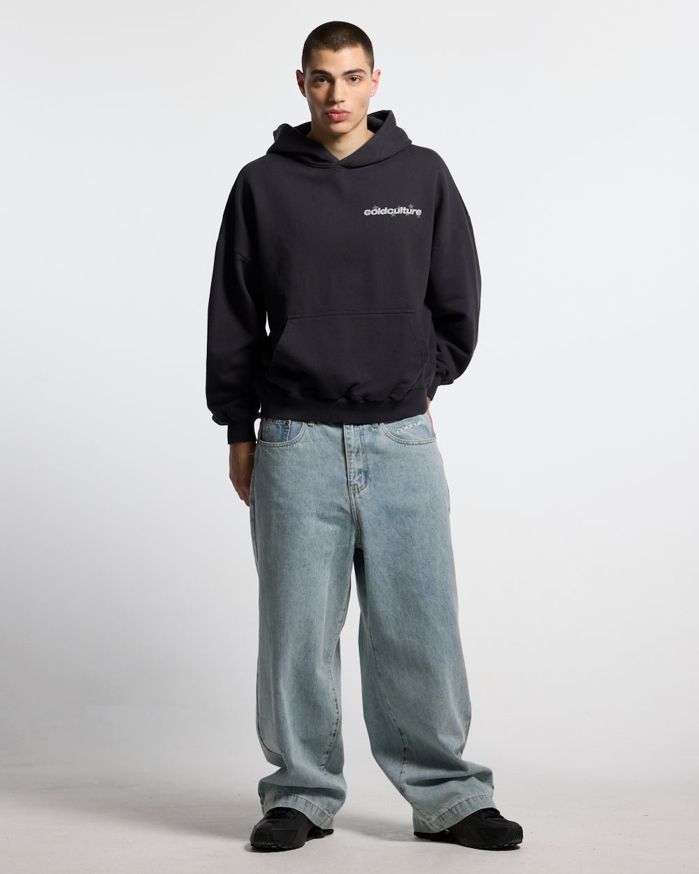 STELLAR HOODIE BLACK - black oversized hoodie, front view on male model - Cold Culture #man