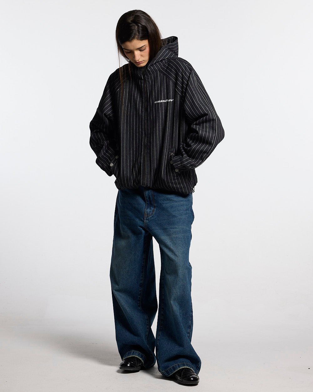 STRIPES CASINO JACKET NAVY - navy pinstripe hooded jacket, front view on female model - Cold Culture #woman