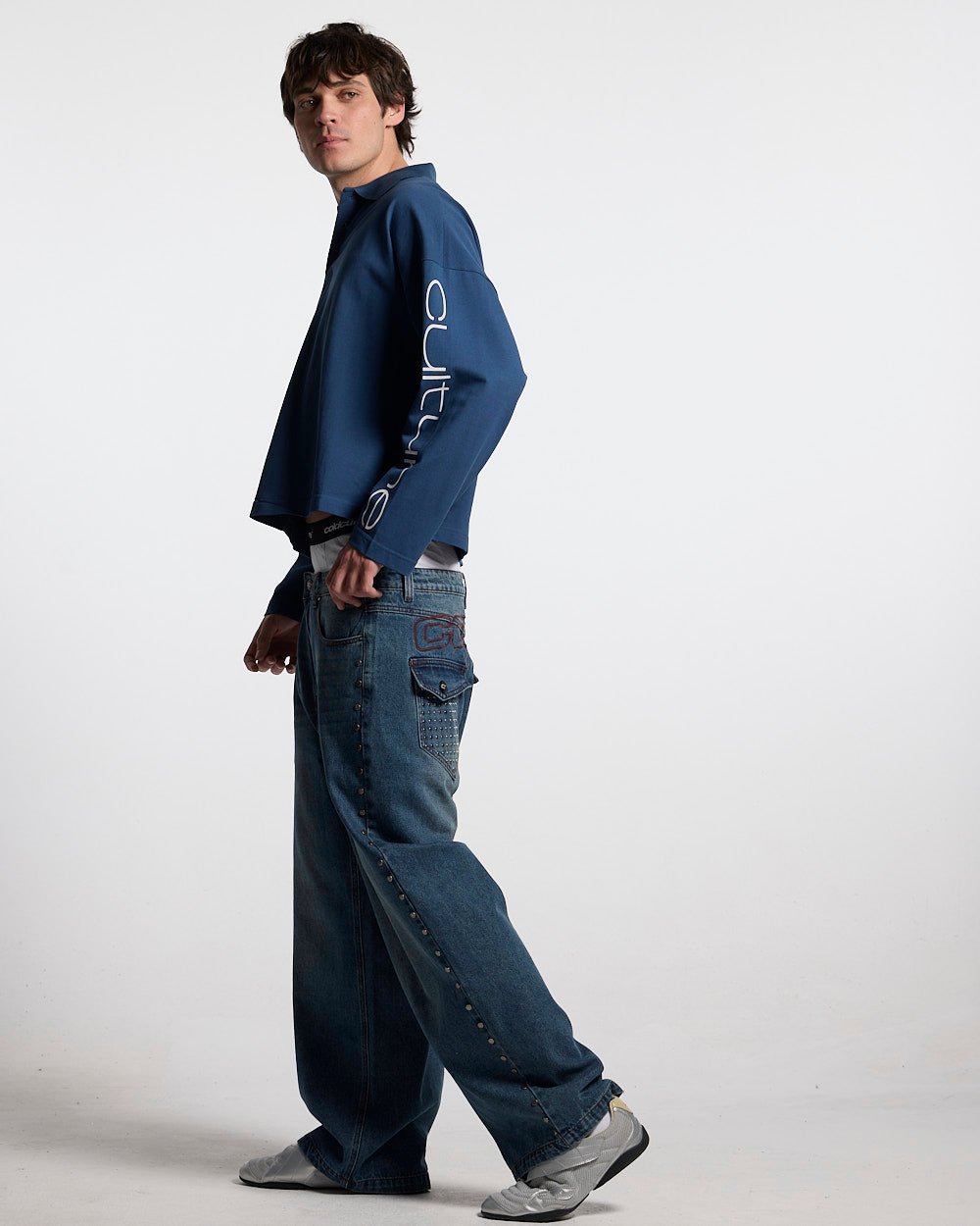 STUDS PANTS LIGHT BLUE DENIM - washed blue studded denim pants, side view - Cold Culture #man