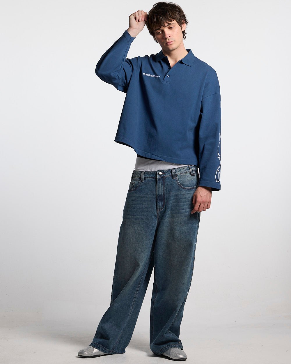 STUDS PANTS LIGHT BLUE DENIM - washed blue studded denim pants, front view on male model - Cold Culture #man