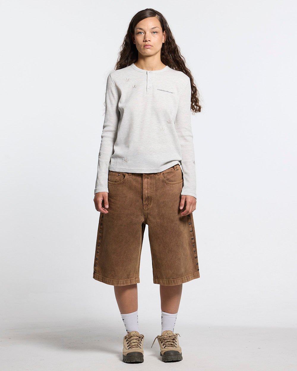 STUDS SHORT BROWN - brown studded denim shorts, front view on female model - Cold Culture #woman