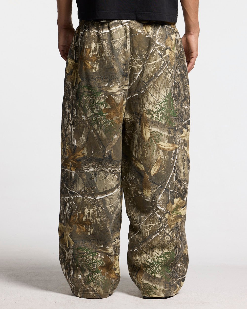 SWEATPANTS REALTREE EDGE - brown camo sweatpants, back view on male model - Cold Culture