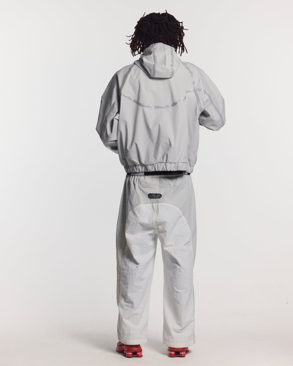 TAKE OFF LIGHTWEIGHT JACKET LIGHT GREY - light grey reflective trim jacket, back view on male model - Cold Culture