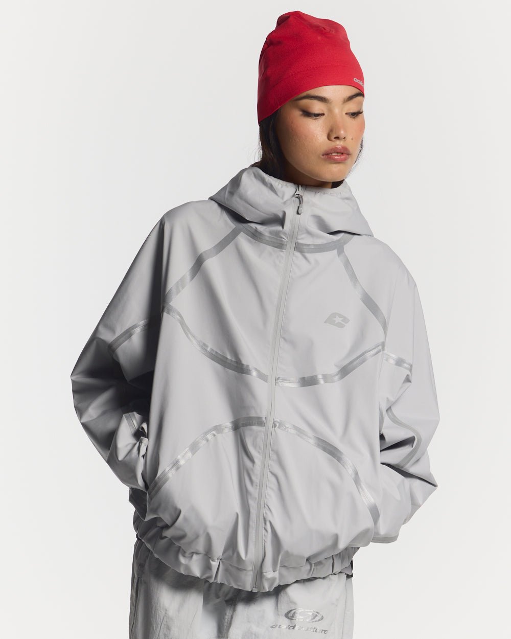 TAKE OFF LIGHTWEIGHT JACKET LIGHT GREY - light grey reflective trim jacket, front view on female model - Cold Culture #woman